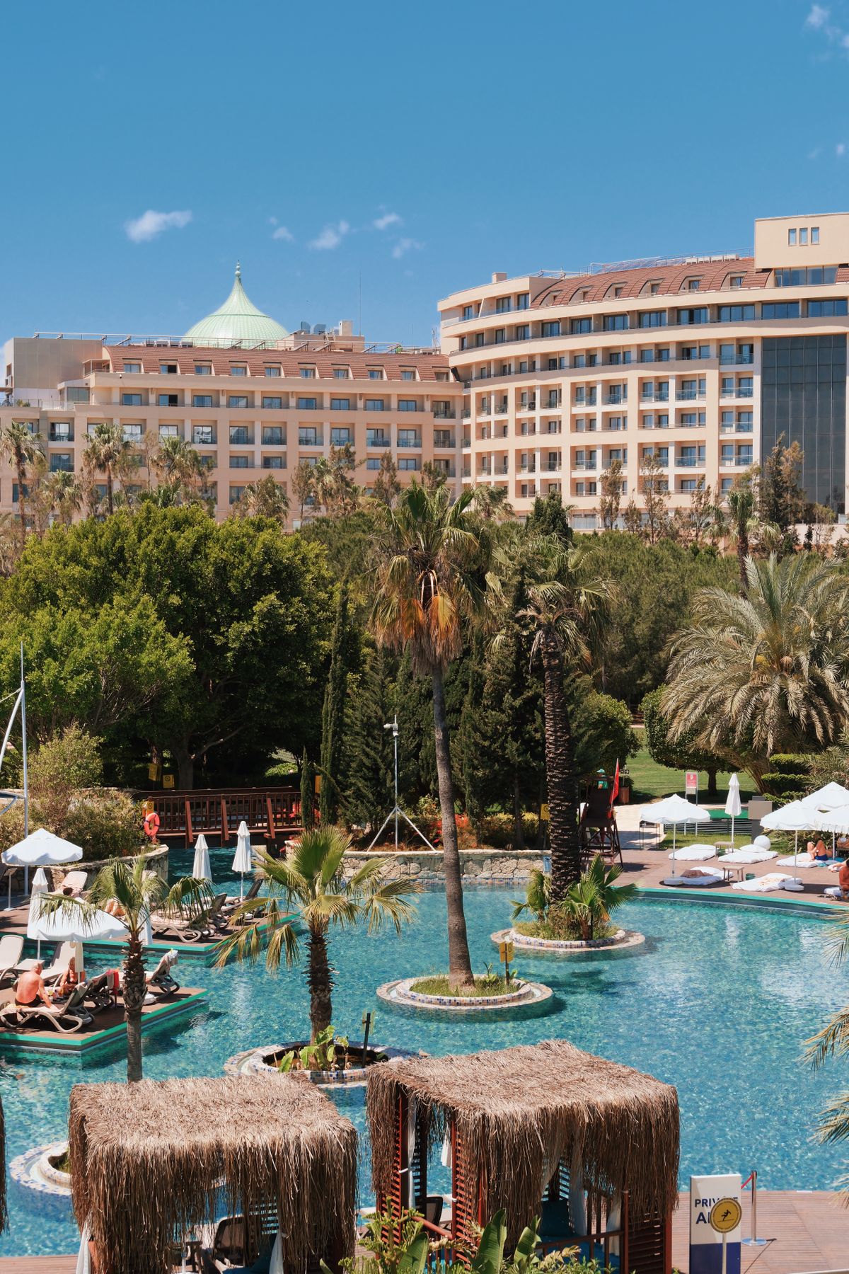 A five-star resort hotel with pools and palm trees