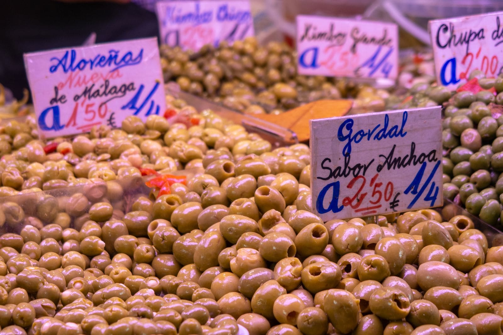Olives priced in euros at a Spanish market stall