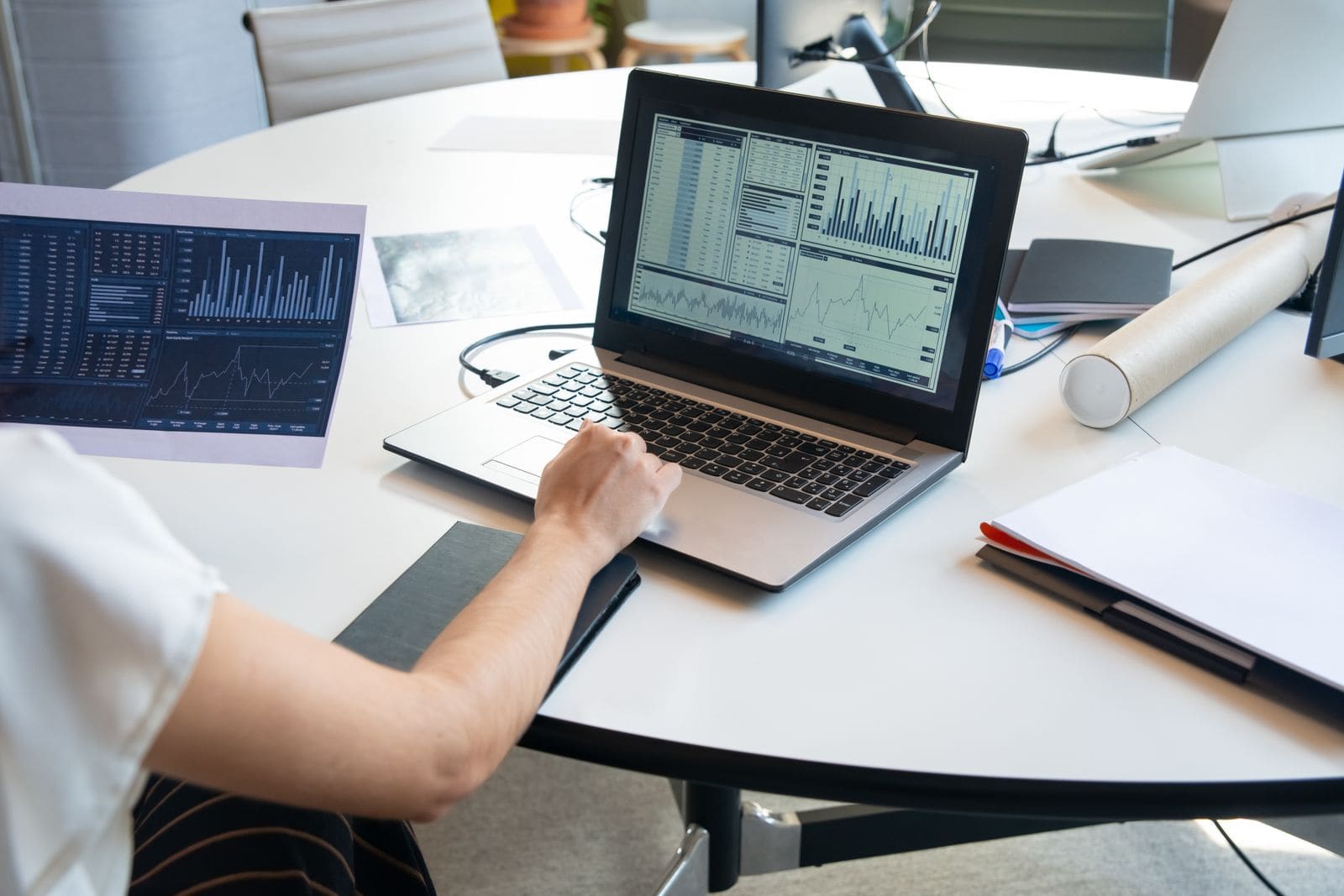 Property price data and charts on a laptop