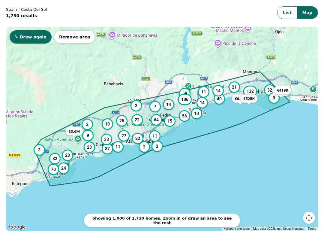 The PropertyList map on a computer with an outline drawn along the coast between Marbella and Estepona. The results count above the map shows the homes inside the outline.
