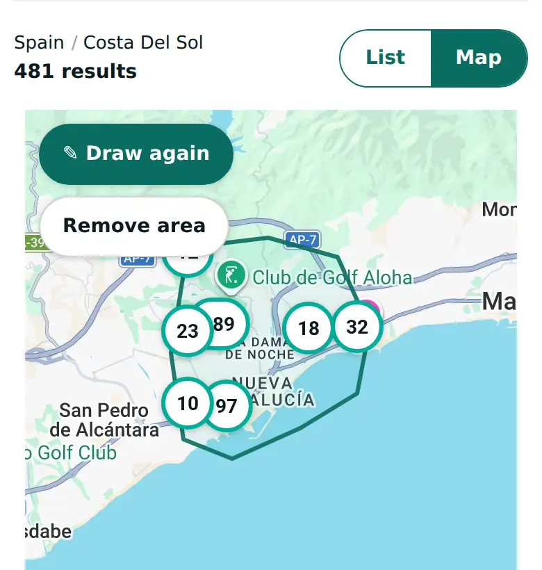 The PropertyList map on a phone, with an area outlined near Marbella. The results count above the map shows the homes inside it.